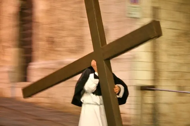Cross bearer on the Good Friday procession, Gubbio, Umbria